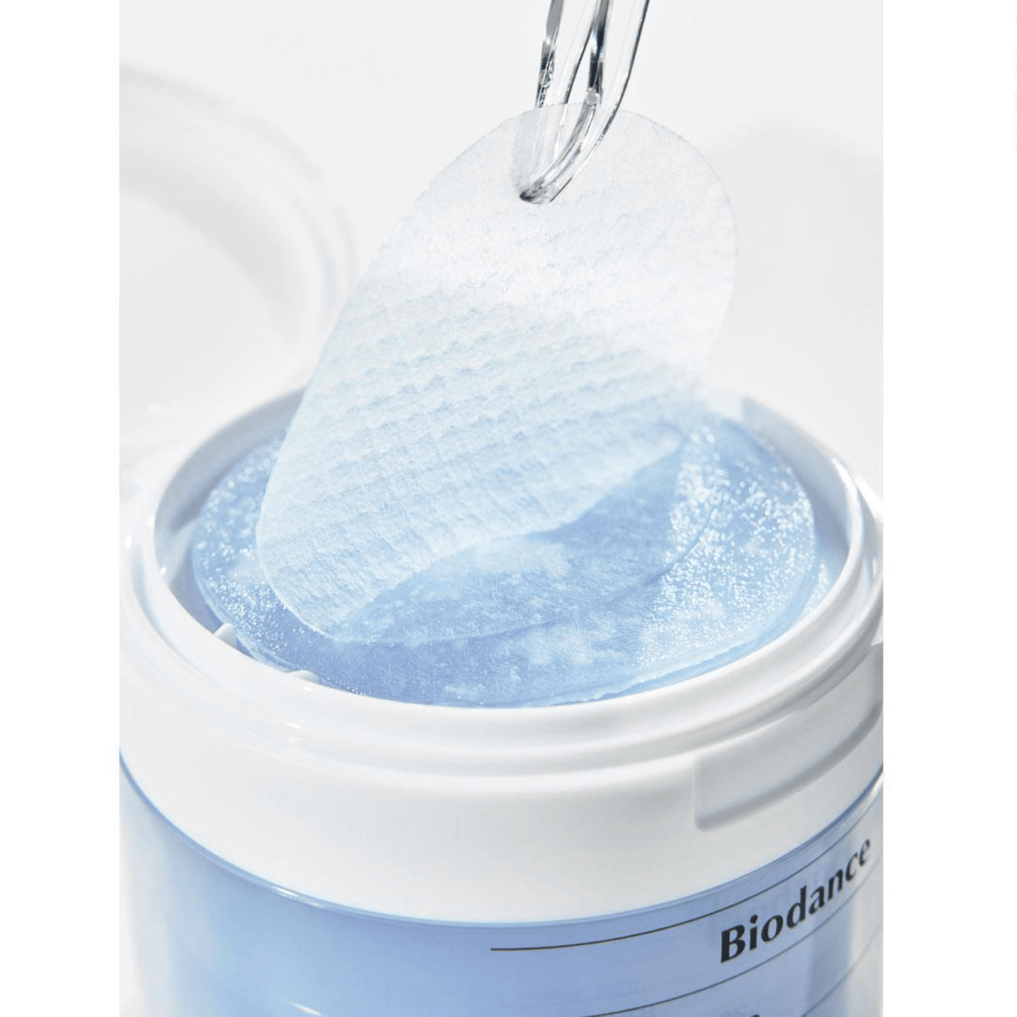 Biodance Cera-nol Gel Toner Pads being lifted from the container, designed for soothing and moisturizing sensitive skin.