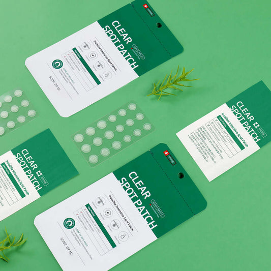 Some By Mi Clear Spot Patch packaging and patches on a green background, designed for acne healing and protection.
