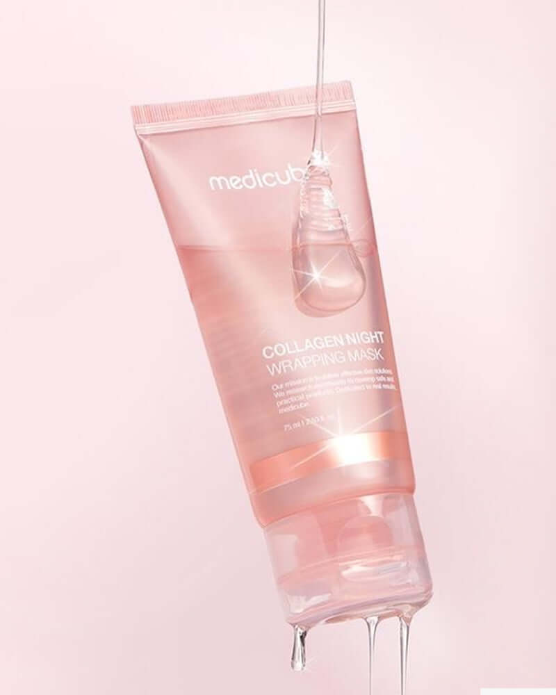 Medicube Collagen Night Wrapping Mask tube with a glowing texture on a soft pink background, boosting skin hydration and elasticity.